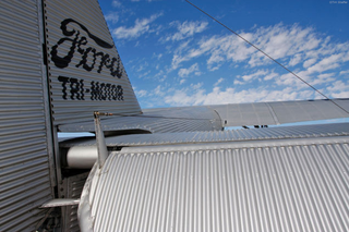 A detail of the Ford Trimotor (NC8407) showing the corrugated metal skin and exposed control cables. (Tim Shaffer)